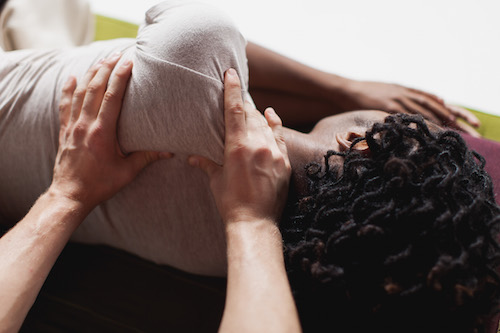 Relaxing shoulder massage in side-lying position