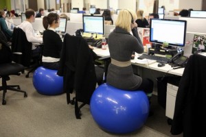 office workers on exercise balls instead of chairs